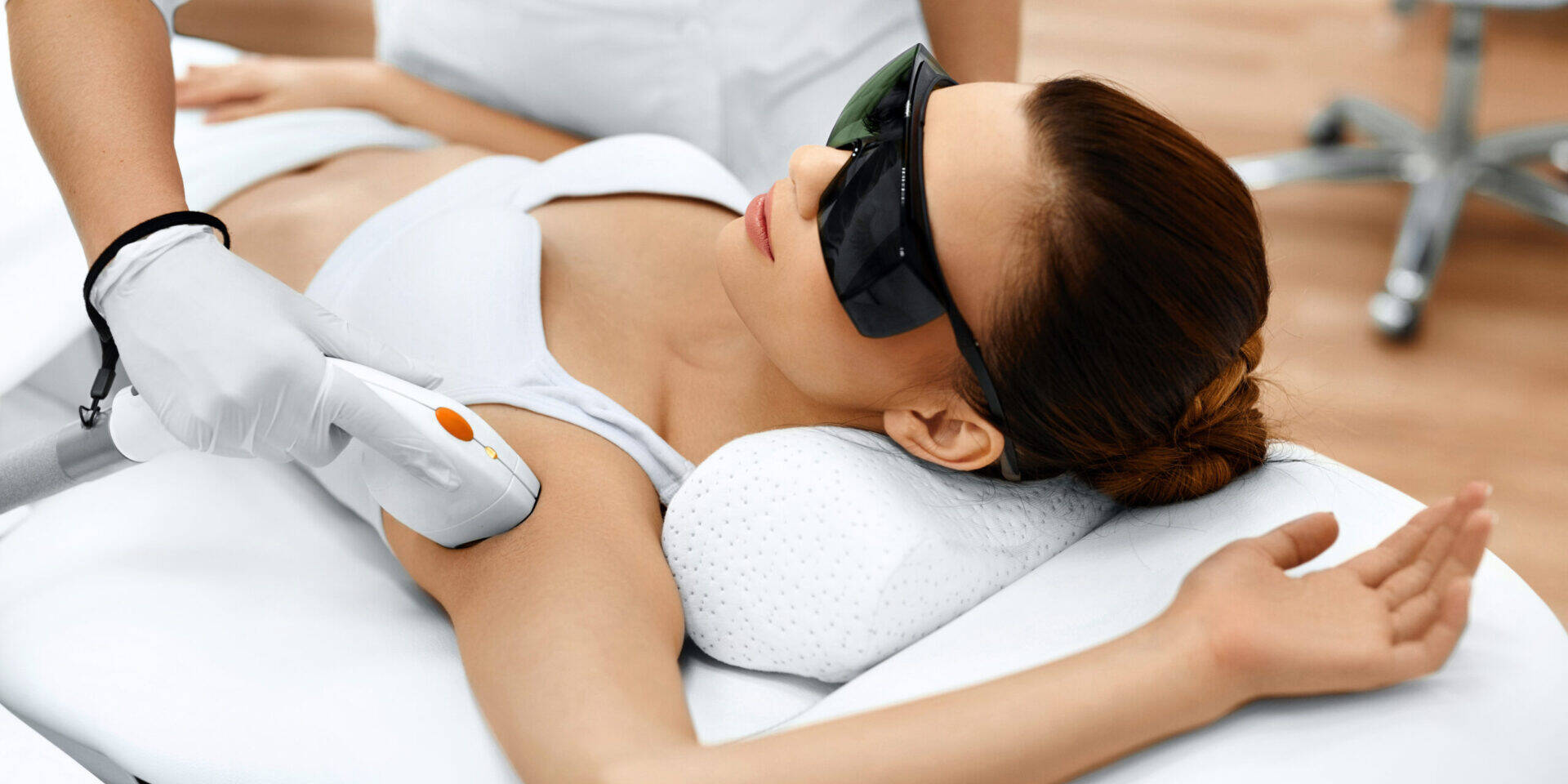 Body Care. Underarm Laser Hair Removal. Beautician Removing Hair Of Young Woman's Armpit. Laser Epilation Treatment In Cosmetic Beauty Clinic. Hairless Smooth And Soft Skin. Health And Beauty Concept.